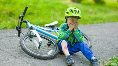 crying child that had fallen from a bicycle